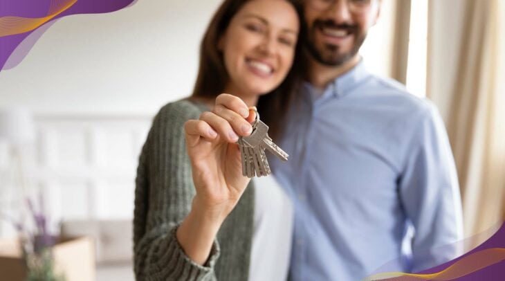 Woman holding keys to new home.