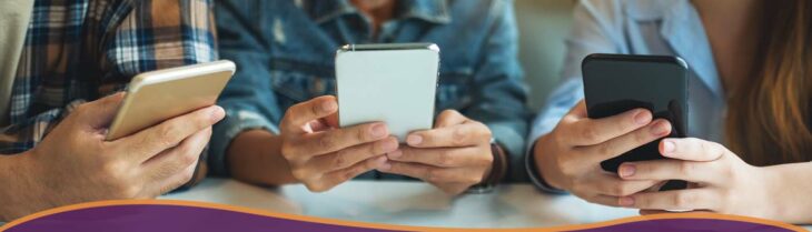 3 smartphones being held.