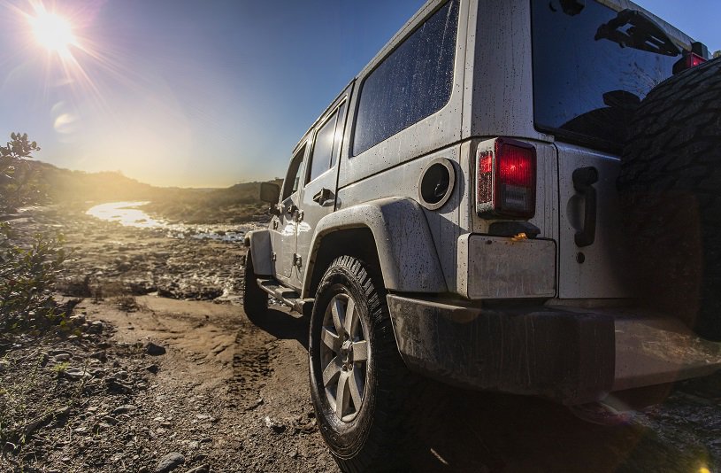 SUV near lake in desert