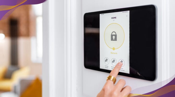 Person setting smart home security system on wall tablet.