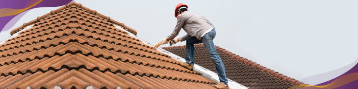 Man on roof inspecting quality.