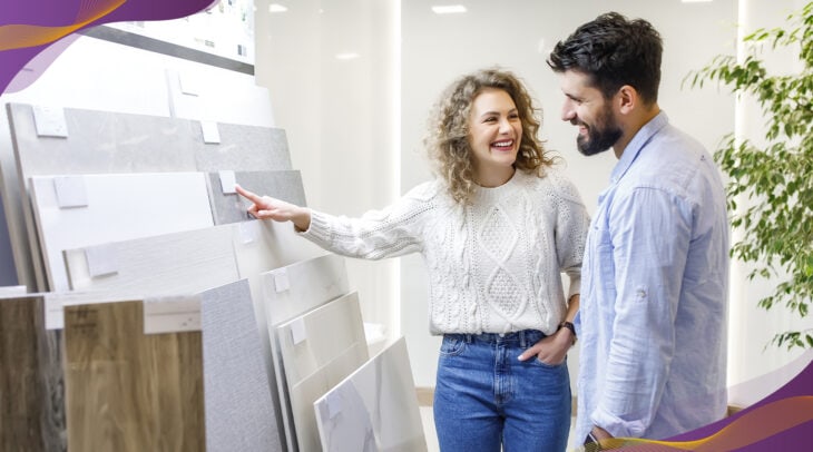 Happy couple shopping at a showroom for countertops.