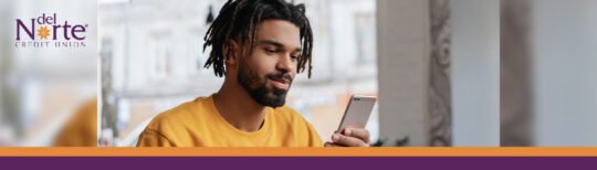 Young man looking at smartphone