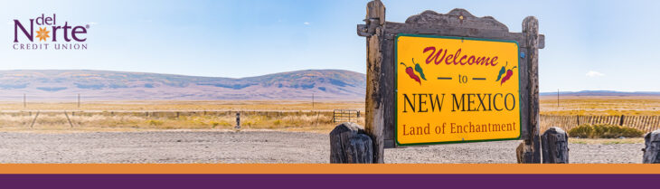 Sign in desert that says Welcome to New Mexico land of Enchantment