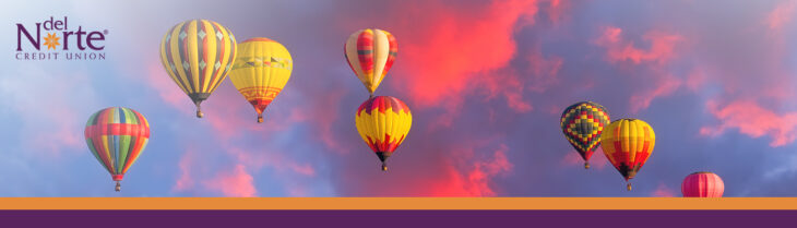 Colorful hot air balloons in a sunset sky