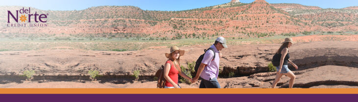 Family of 3 hiking in the New Mexico desert