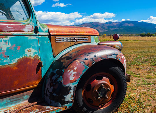 Multi-colored rustic truck outside of Taos New Mexico