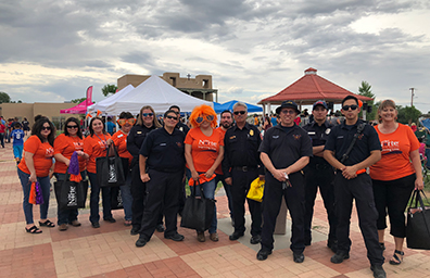 A group of DNCU employees stand together outside of summer concert in Espanola New Mexico