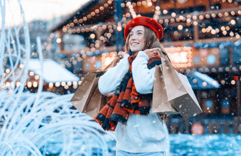 A woman shopping in the snow.