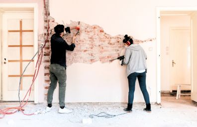 A couple works on their home repairs.