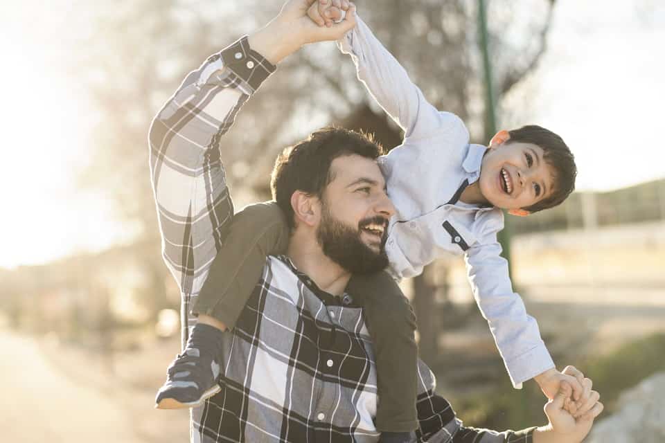 Man With Child On Shoulders