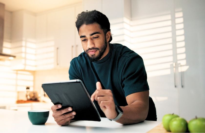 A young man checks his accounts online.