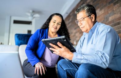A couple checks their accounts to fight fraud.