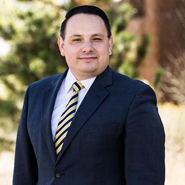 Mortgage Officer Ralph Flores Outside DNCU Branch