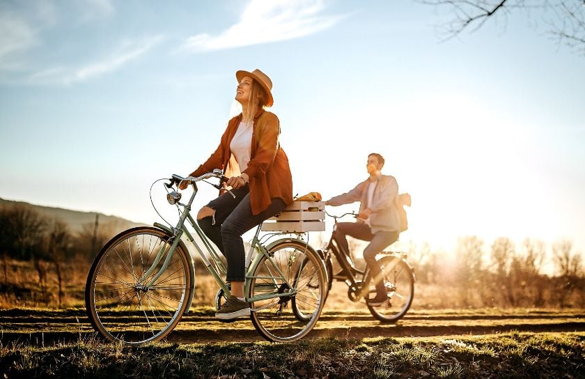 A couple takes a bike ride.