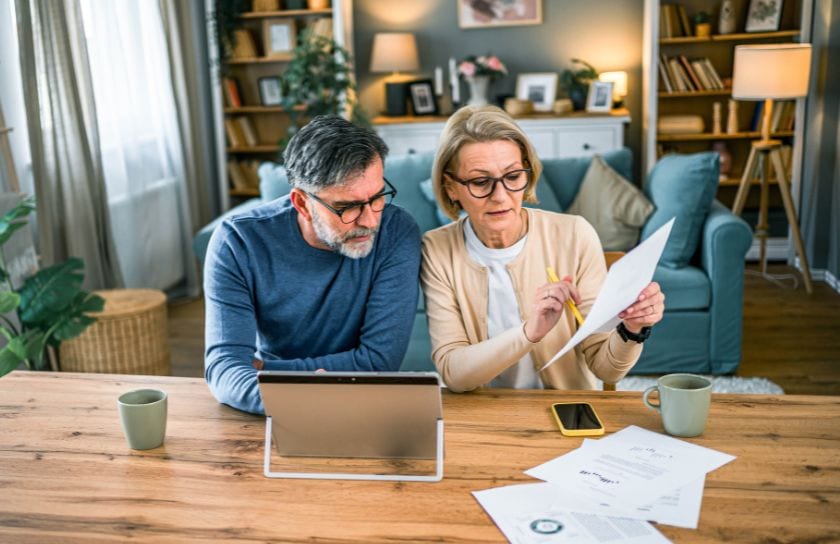 Older couple doing their taxes.