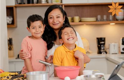 A mom cooks with her kids
