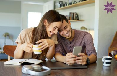 A young couple checks their investments