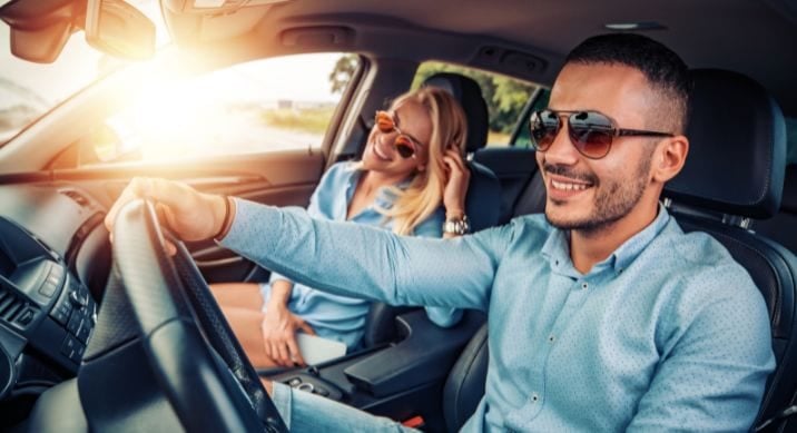 A couple takes a drive in their new car financed by Del Norte Credit Union