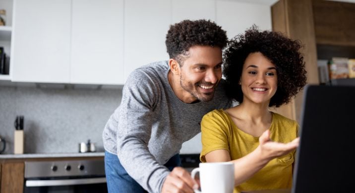 A young couple works on their finances together