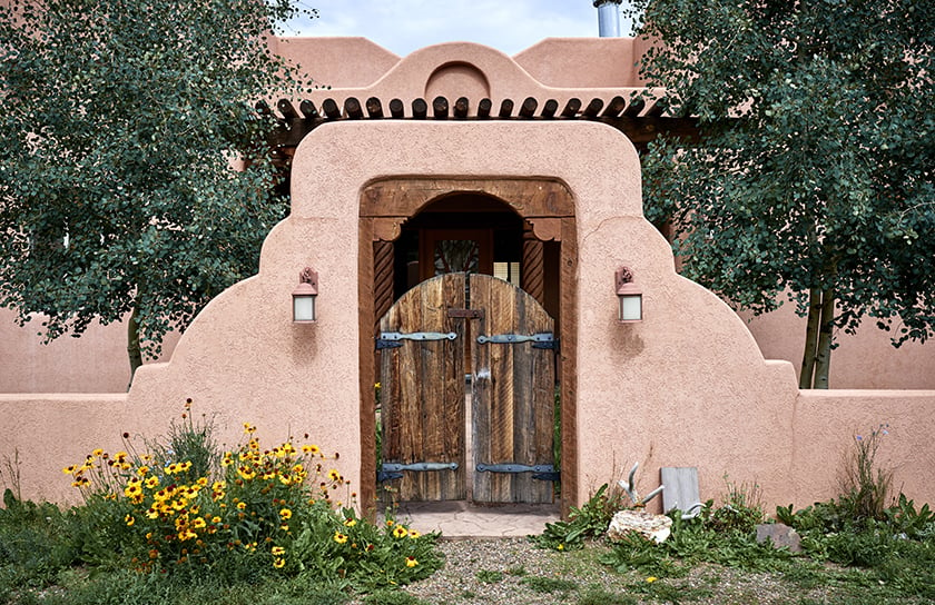 Beautiful front gate of adobe house in New Mexico