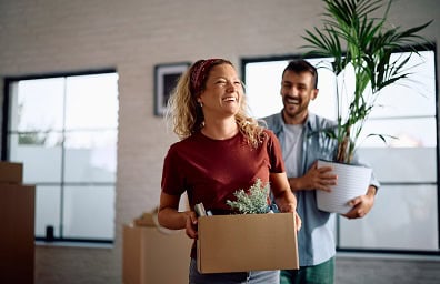 A woman and a man move into a new home