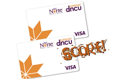 Pair of DNCU credit cards with logo that reads SCORE!