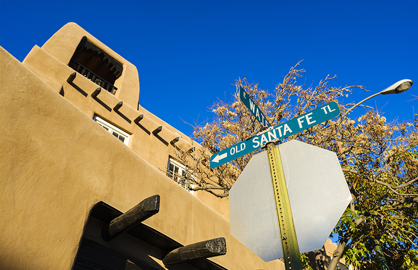 Adobe building in Santa Fe with street sign that reads Old Santa Fe Trail